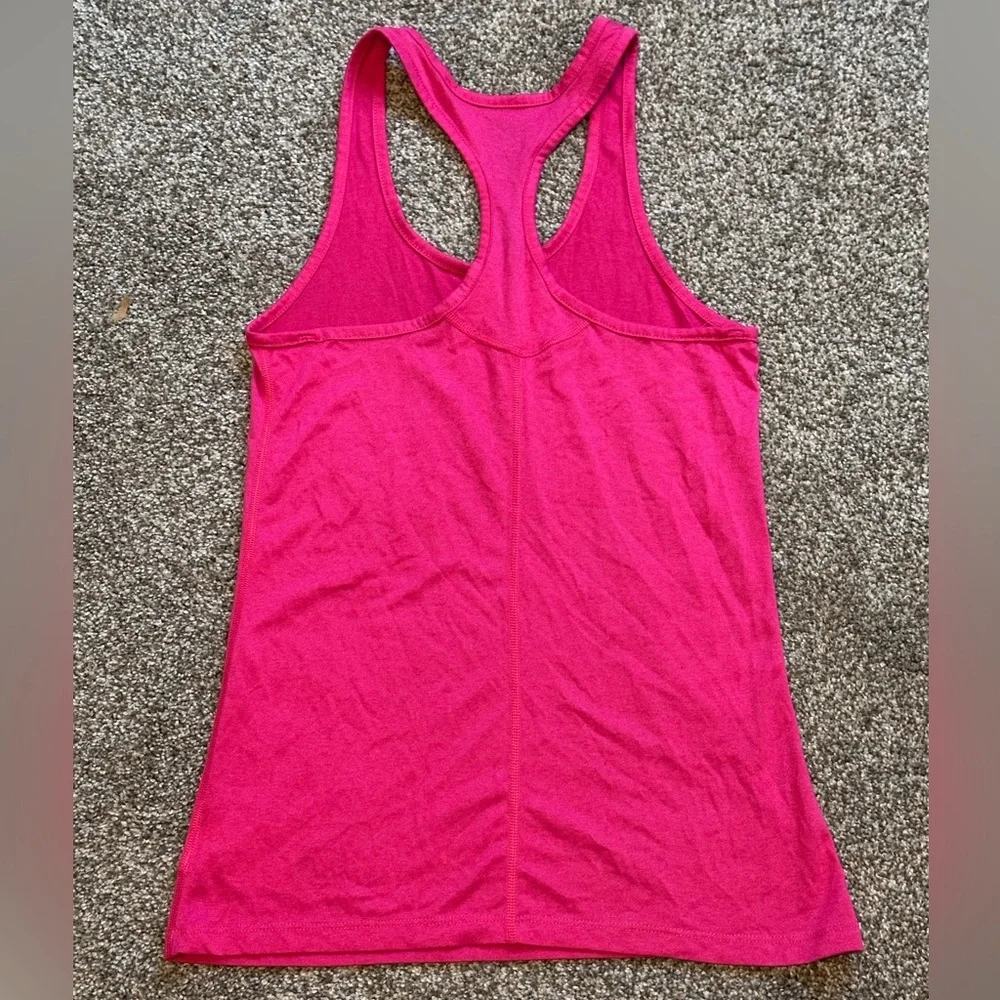 Nike Women’s Dri-FIT Racerback Tank Top in Bright Pink